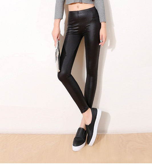 Faux leather pants, wearing thin leggings, black feet trousers