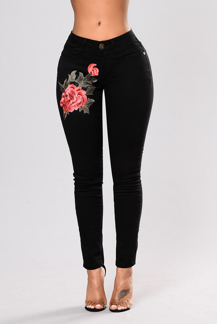 Black jeans with embroidered feet